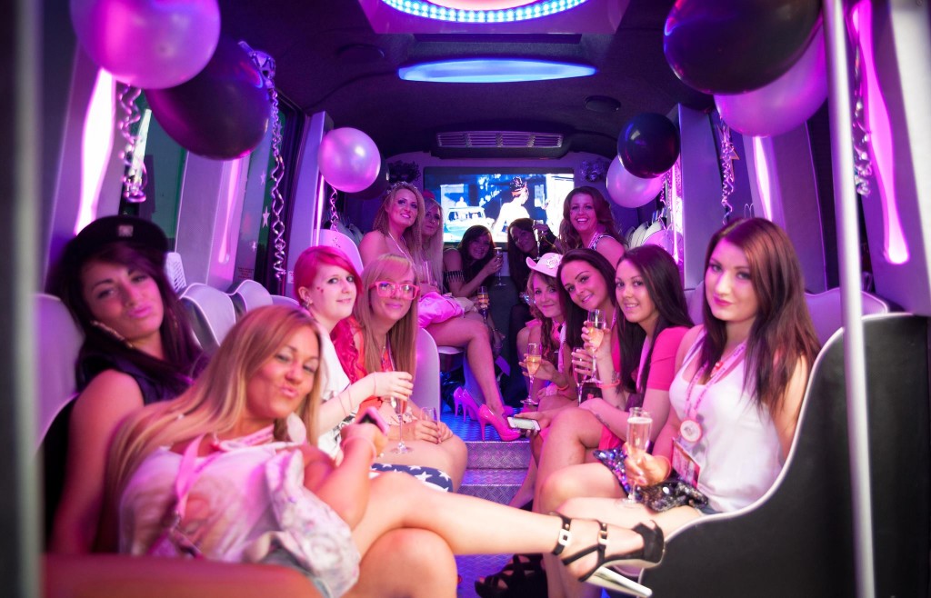 A group of friends enjoying the inside of a party bus from Swift Travel